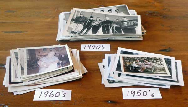 old photos on table sorted by year